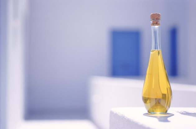 Cooking oil in bottle with cork, close-up