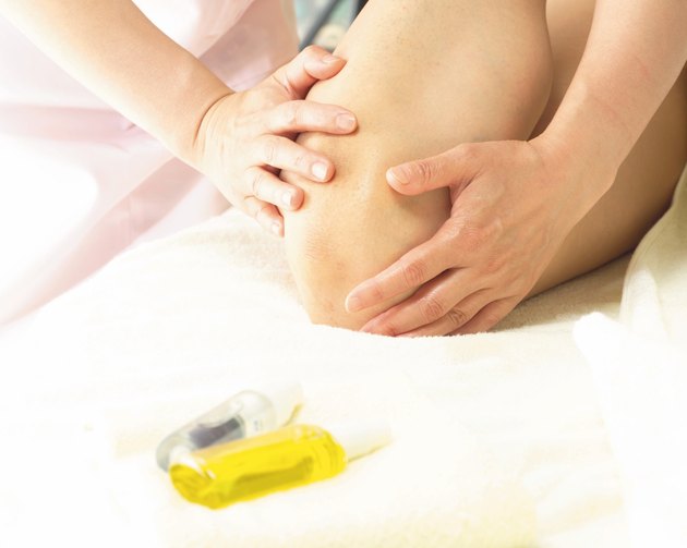 Aesthetician Who Anoints Womans Knee With Oil